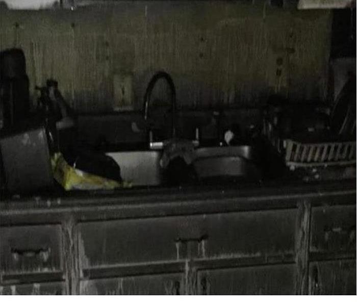 burned and soot covered kitchen